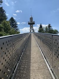 Walkway against sky