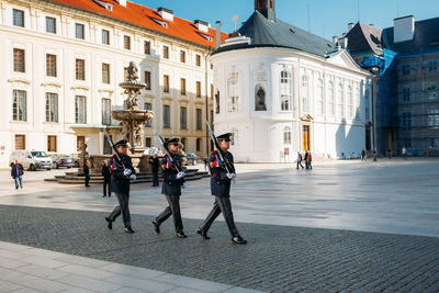 People walking on street in city