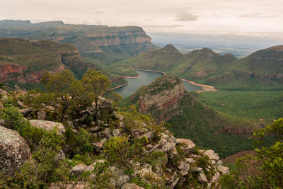 High angle view of rocks and mountains against sky