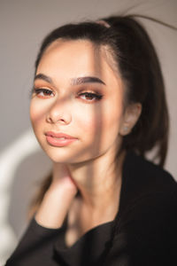 Close-up portrait of young woman