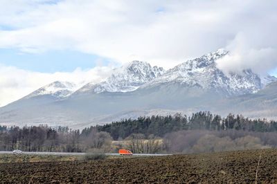 Scenic view of snowcapped mountains against sky