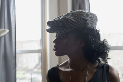 Portrait of beautiful young woman looking away