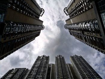 Low angle view of buildings against sky in city