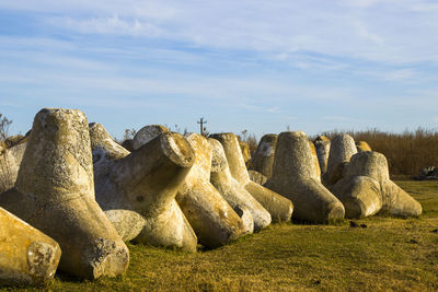 Panoramic view of rocks on land against sky