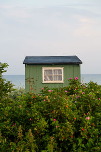 House by sea against sky