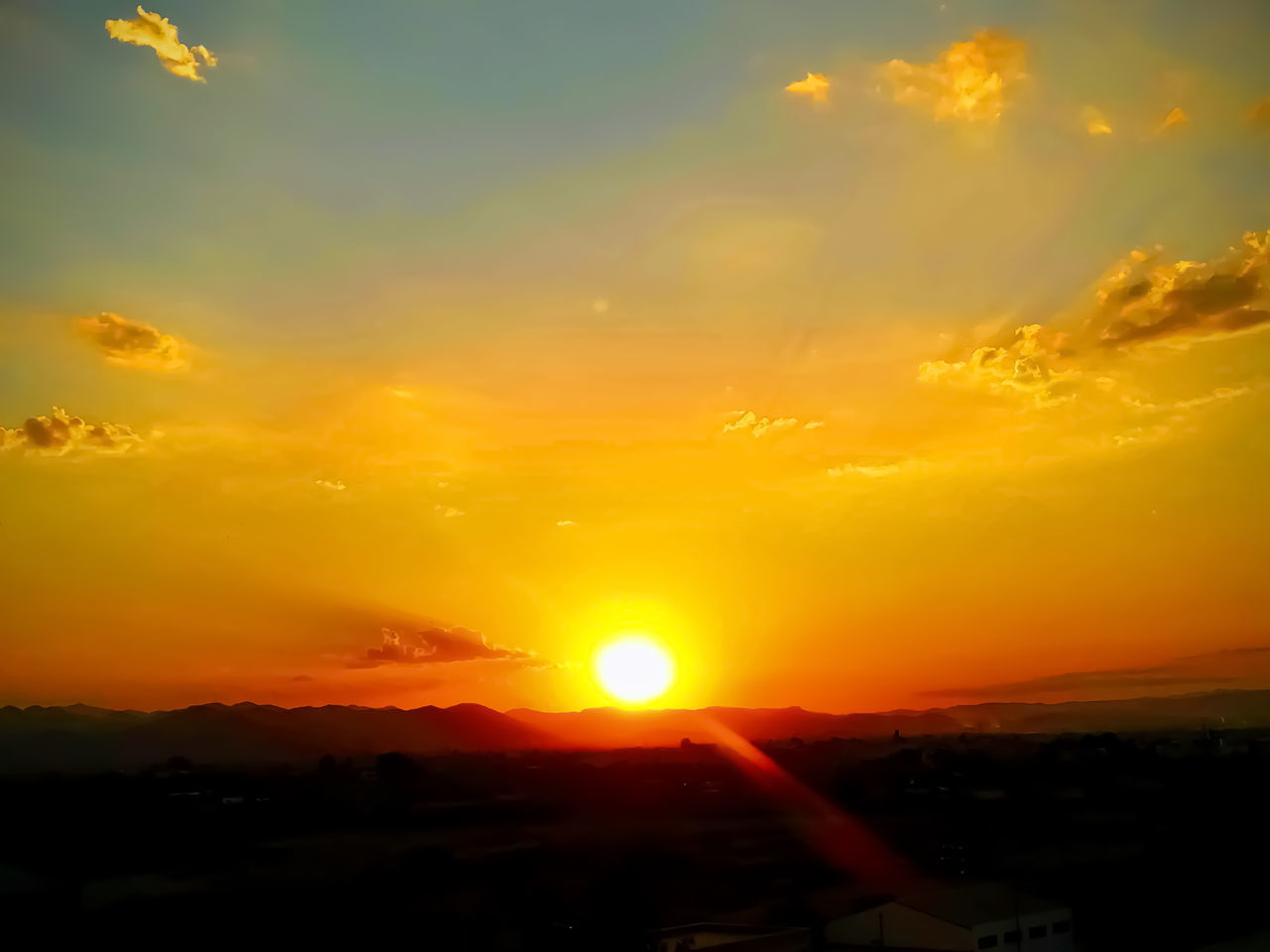 SCENIC VIEW OF SUNSET OVER LANDSCAPE