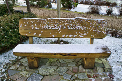 High angle view of empty bench in park