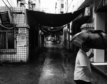 Rear view of man walking in city