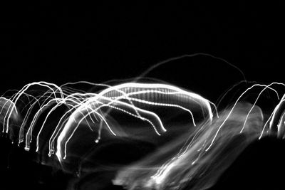 Light trails against sky at night