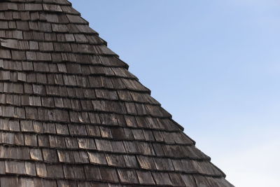 Wooden shingle on a house roof at an old farmers house