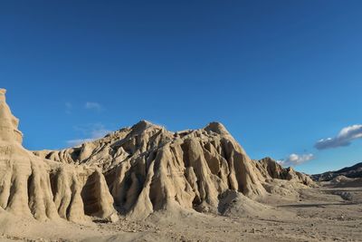 Panoramic view of rock formations against sky