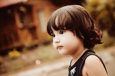 Portrait of girl looking away outdoors