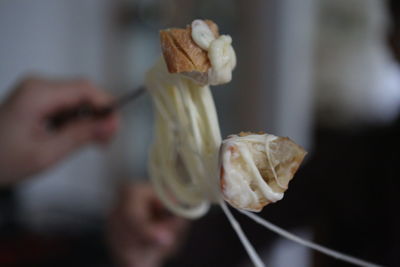 Close-up of hand holding ice cream