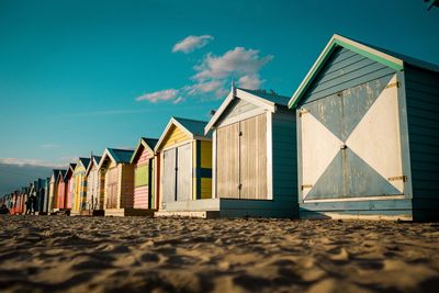 Beach huts against sky