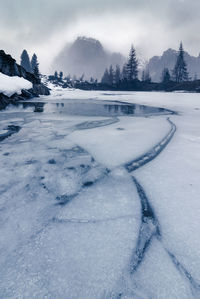 Scenic view of snow covered mountains against sky