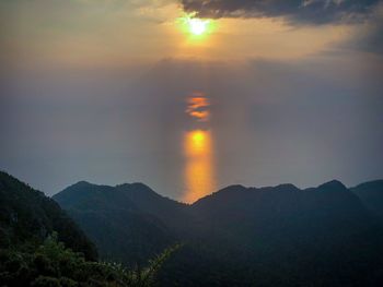 Scenic view of silhouette mountain against sky during sunset