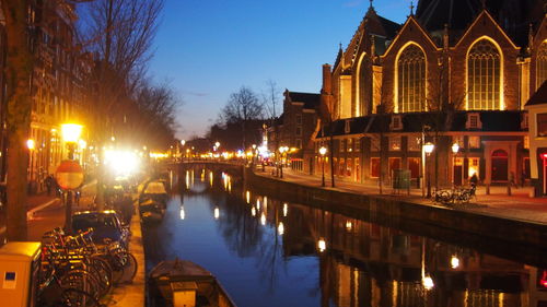 Reflection of illuminated buildings in water