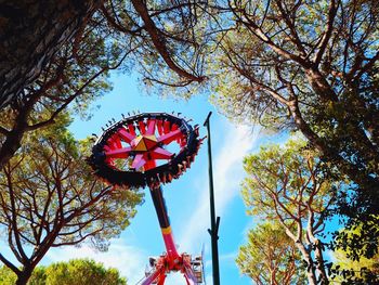 Low angle view of ferris wheel against sky