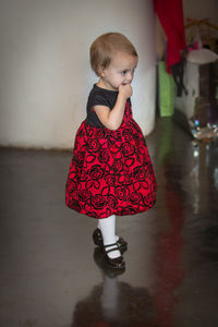 Full length of girl wearing red shirt