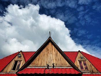 Low angle view of house and building against sky