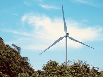 Windmill - power in nature against the blue sky in japan