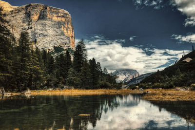 Scenic view of lake and mountains against sky