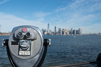 Close-up of cityscape against sea