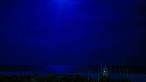 Illuminated blue sky at night