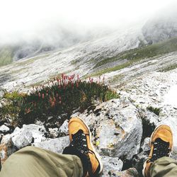 Low section of hiker on rocky mountain