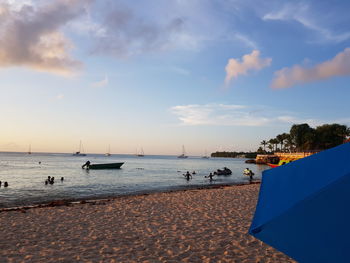 Scenic view of beach against sky during sunset