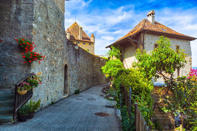 Street amidst buildings against sky