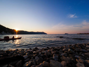 Scenic view of sea against sky during sunset