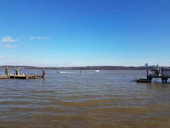 Scenic view of sea against blue sky