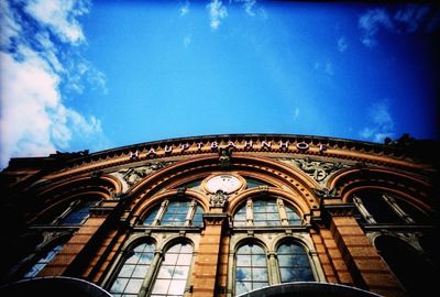 Low angle view of built structure against blue sky