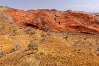 Rock formations in desert against sky