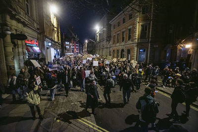 Crowd on city street at night