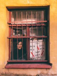 Low angle view of window on wall of building