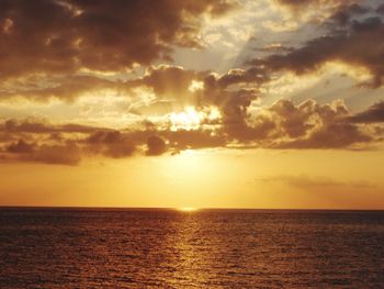 Scenic view of sea against dramatic sky