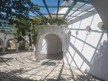 View of building and trees against sky