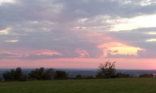 Scenic view of landscape against cloudy sky