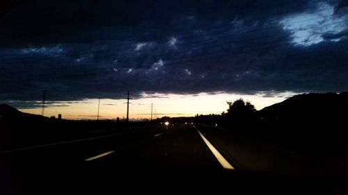 Dramatic sky over road during sunset