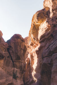 Side lit rocky terrain at petra.