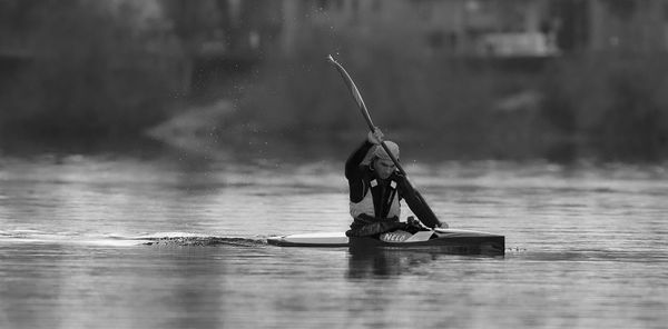 Man on boat in lake