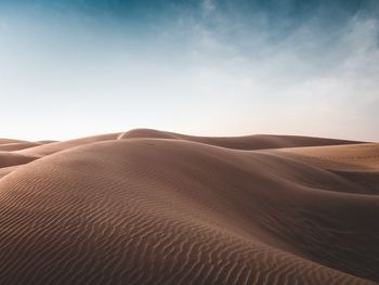 Sand dunes in the desert during the day