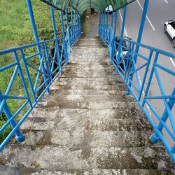 High angle view of steps amidst footpath