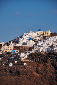 Panoramic aerial view of imerovigli village in santorini island, greece - traditional white houses