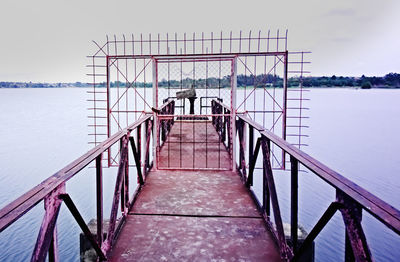 Pier over sea against sky