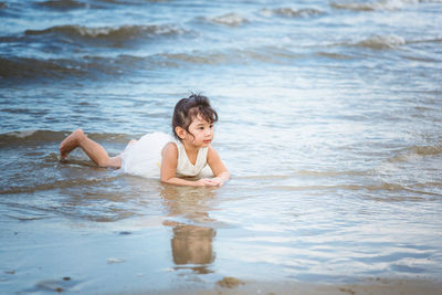 Cute girl lying at beach