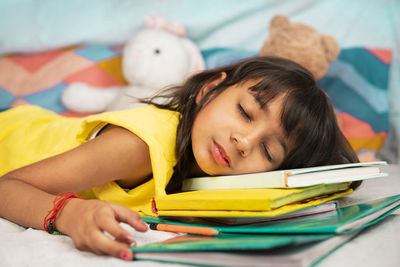 Portrait of girl sleeping at home