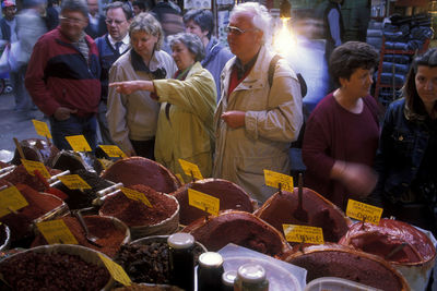 Group of people at market stall